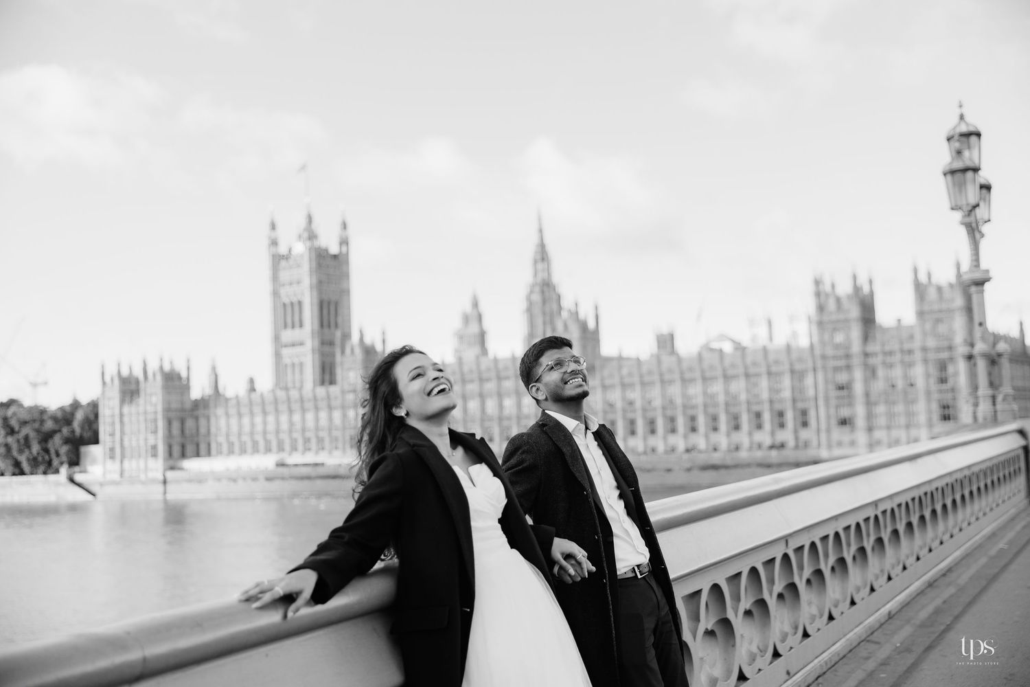Black & white wedding portraits on Westminster Bridge with Parliament in view by a wedding photographer near me in London & Birmingham.
