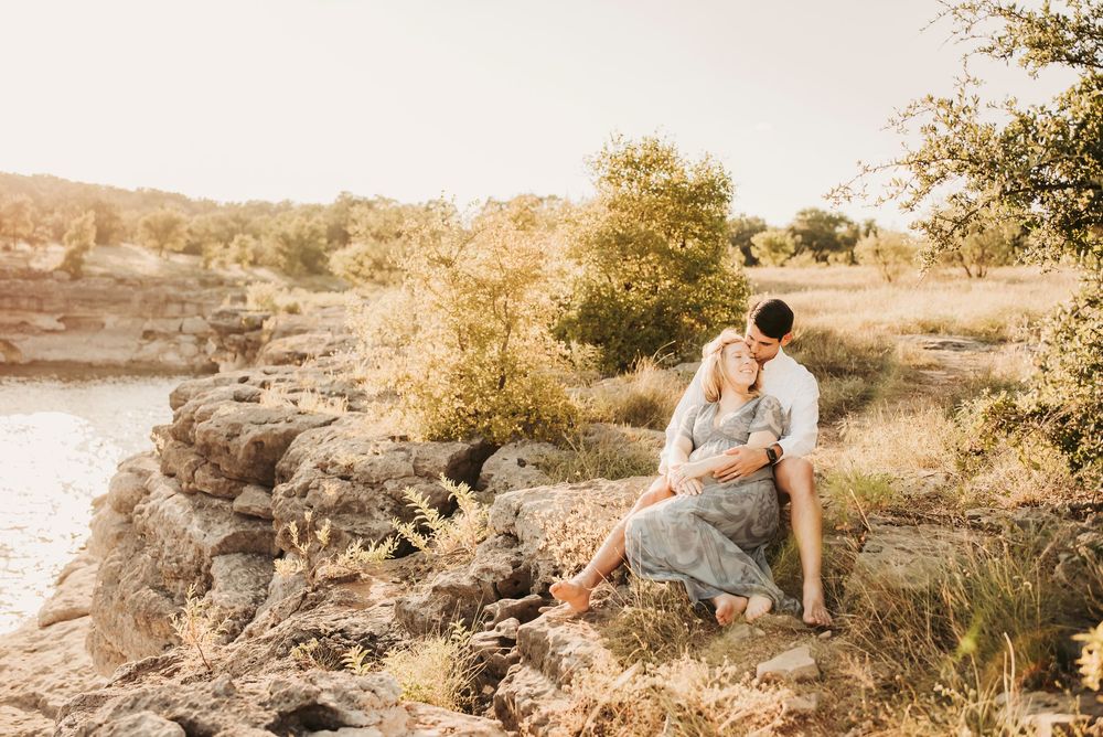 Outdoor maternity session with a glowing pregnant woman at sunset.