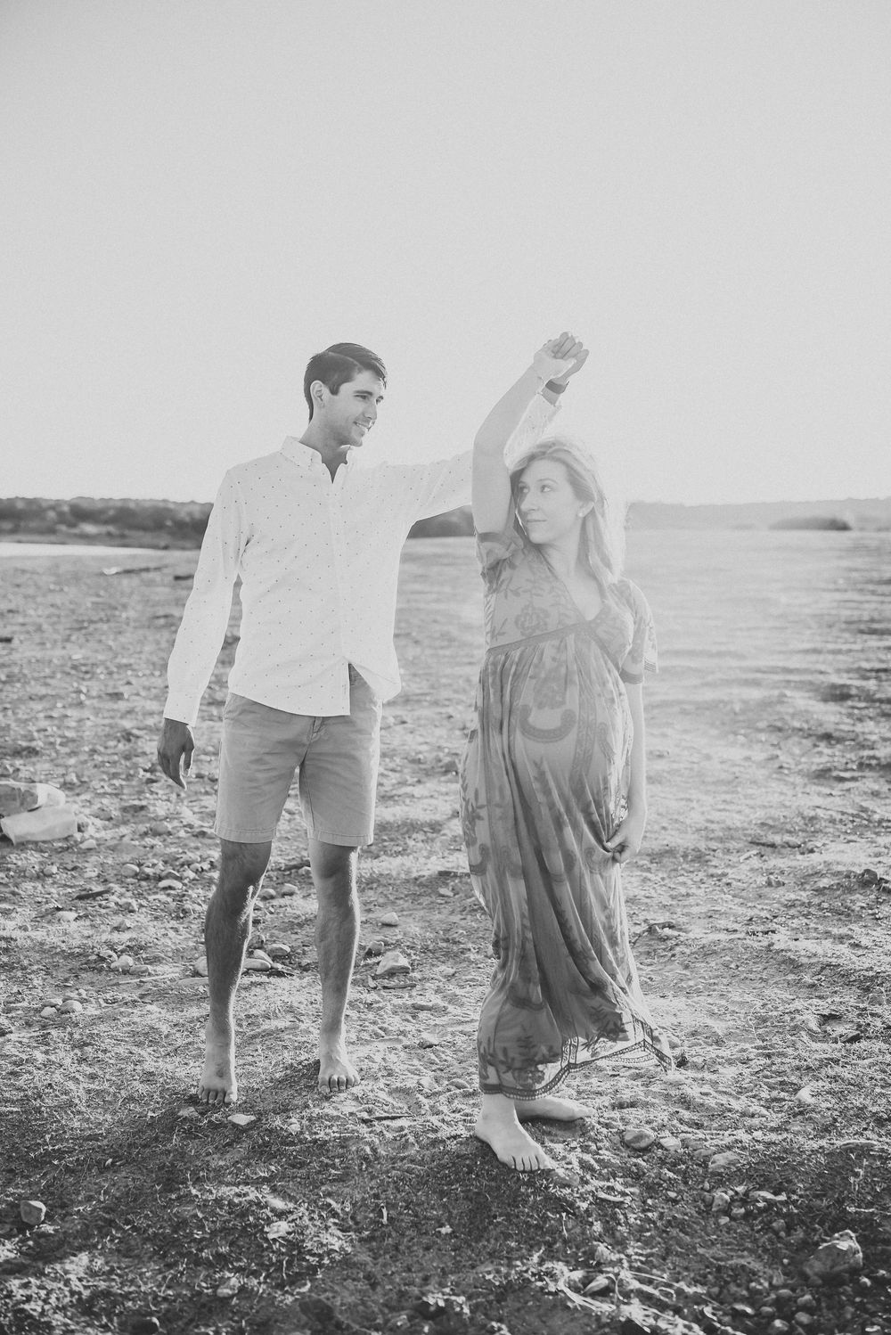 expectant parents dance together