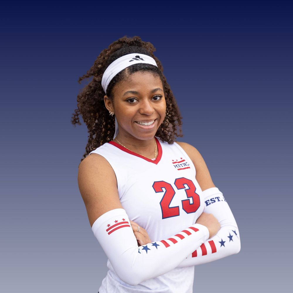 Professional softball player in white jersey and visor poses for a series of photos in front of blue background.