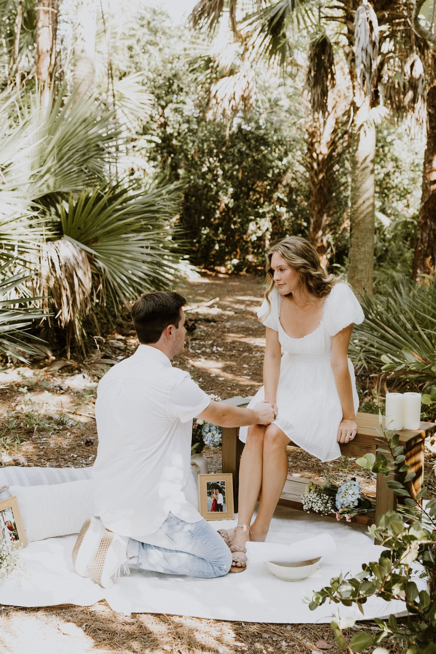 Woodsy proposal in West Palm Beach, Florida at a nature trail captured by Lindsay McDow Photography. Greenery, picnic proposal