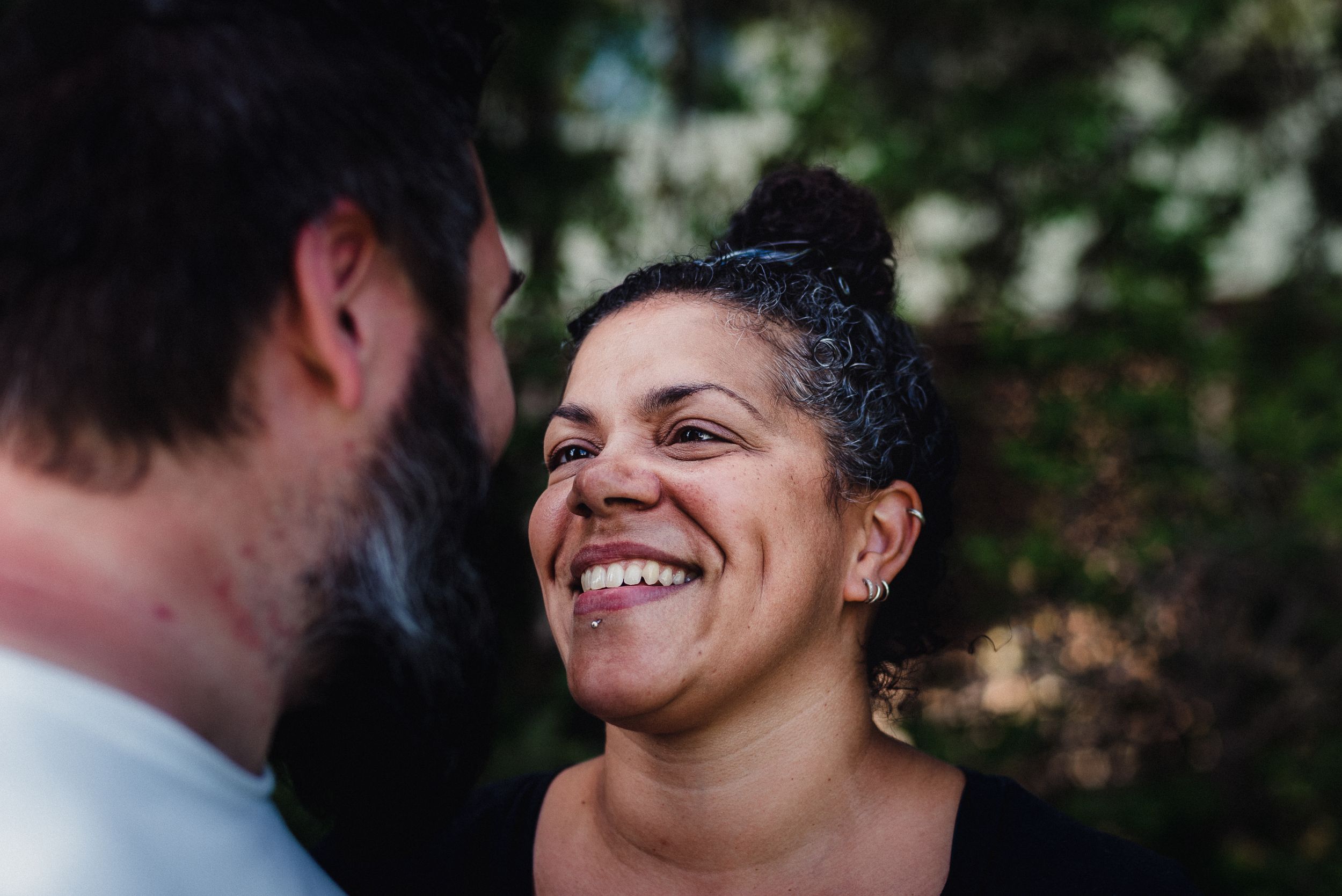 Colour image of a woman smiling at a man.