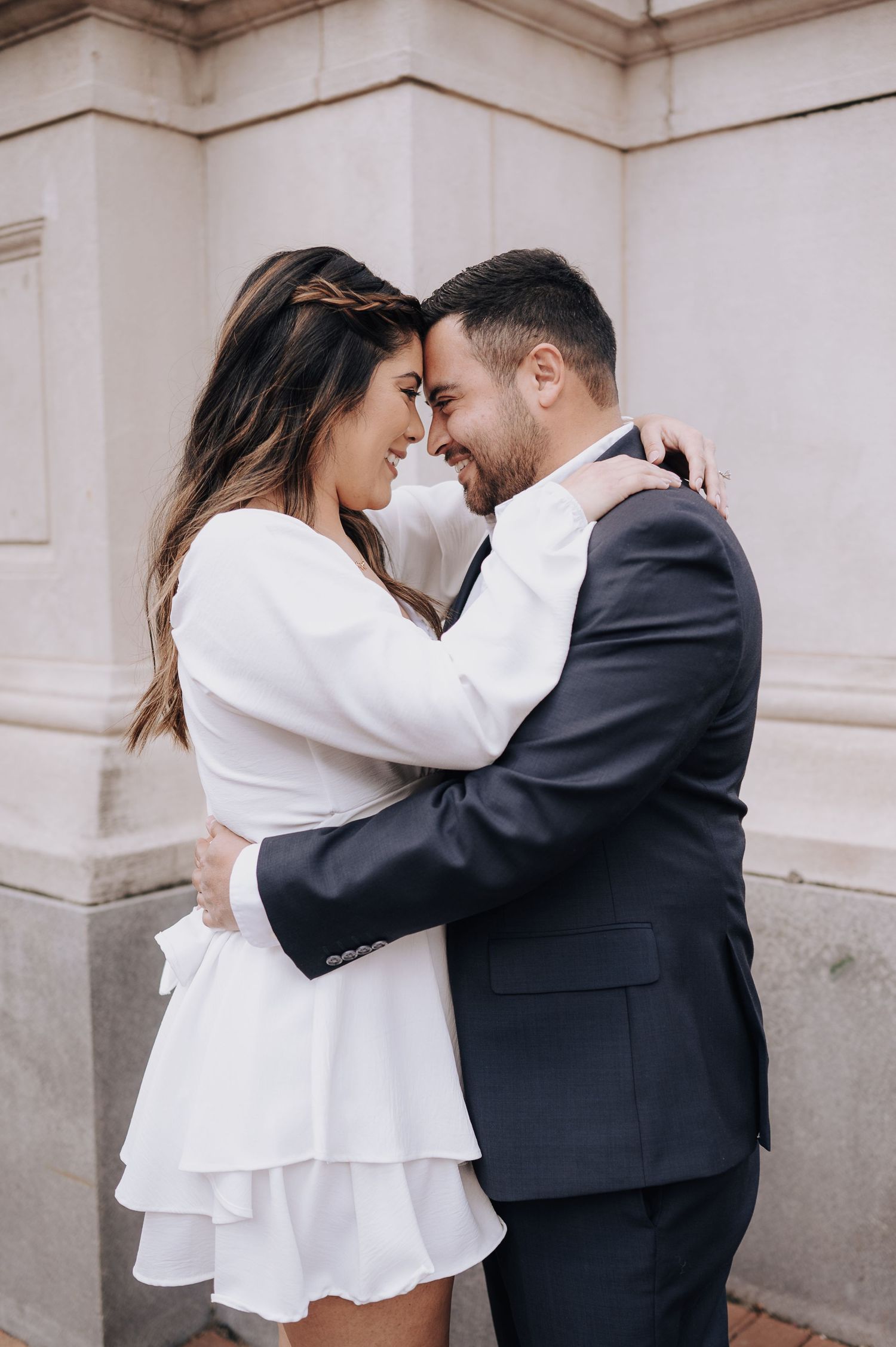 Houston area couple's engagement session. She is wearing white and red-bottom shoes.