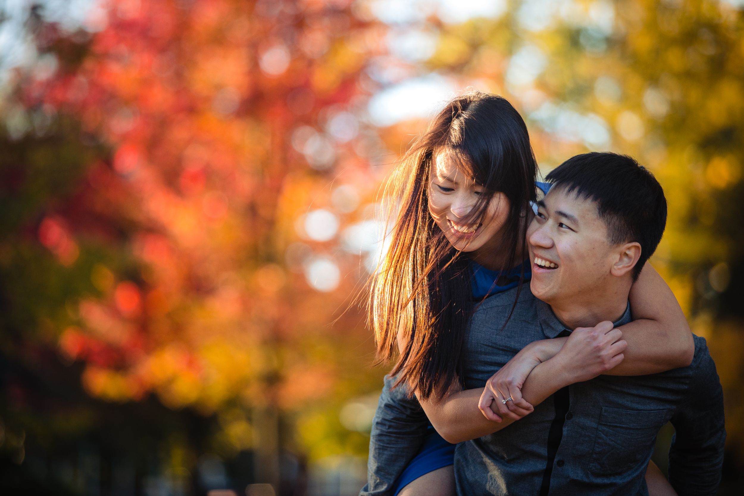 A joyful autumn moment shared among colorful fall foliage.