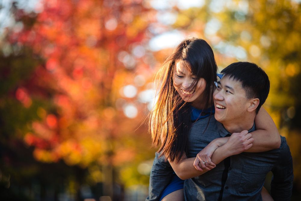 A joyful autumn moment shared among colorful fall foliage.