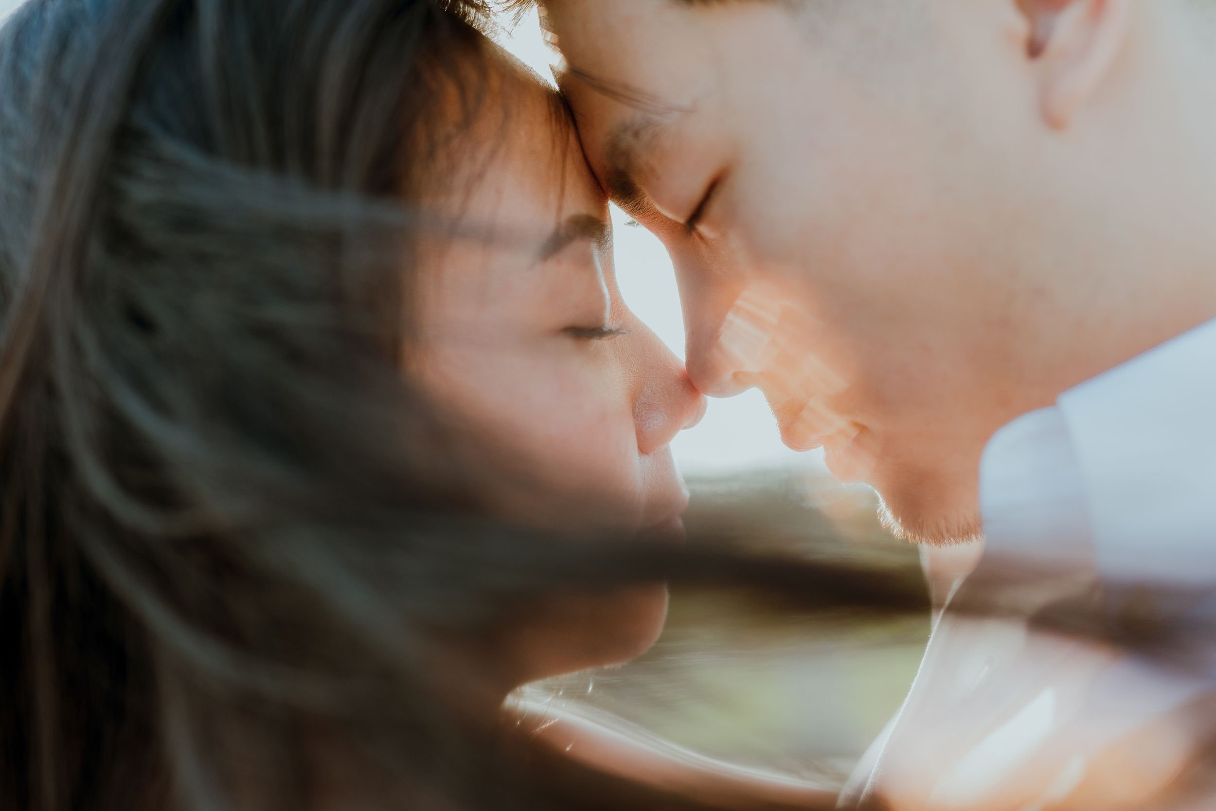 An intimate close-up moment captured with soft natural lighting and gentle shadows.