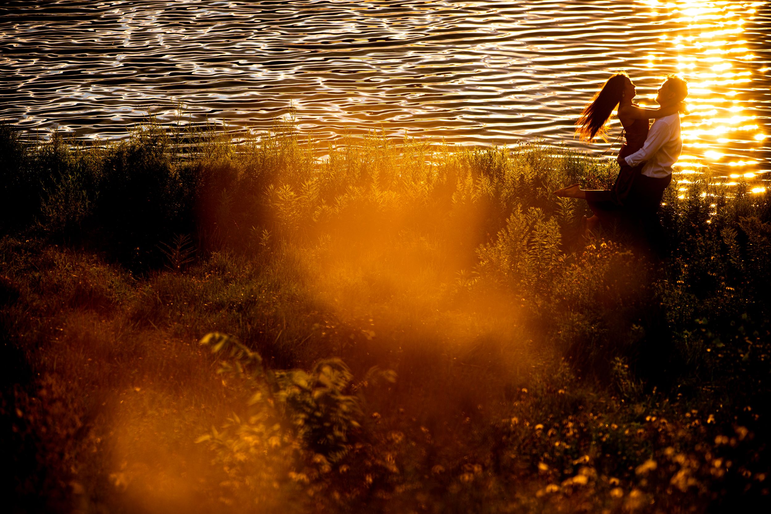A silhouette against a golden sunset creates a dreamy atmospheric scene with filtered light.