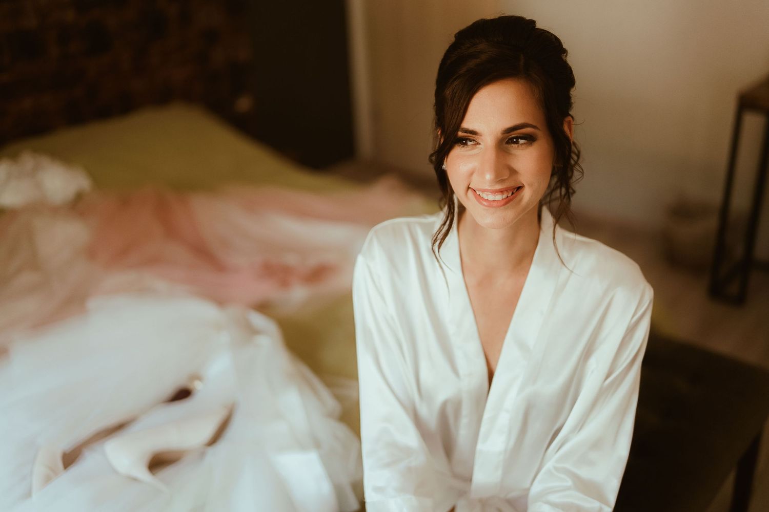Morning wedding preparation scene in a naturally lit room.