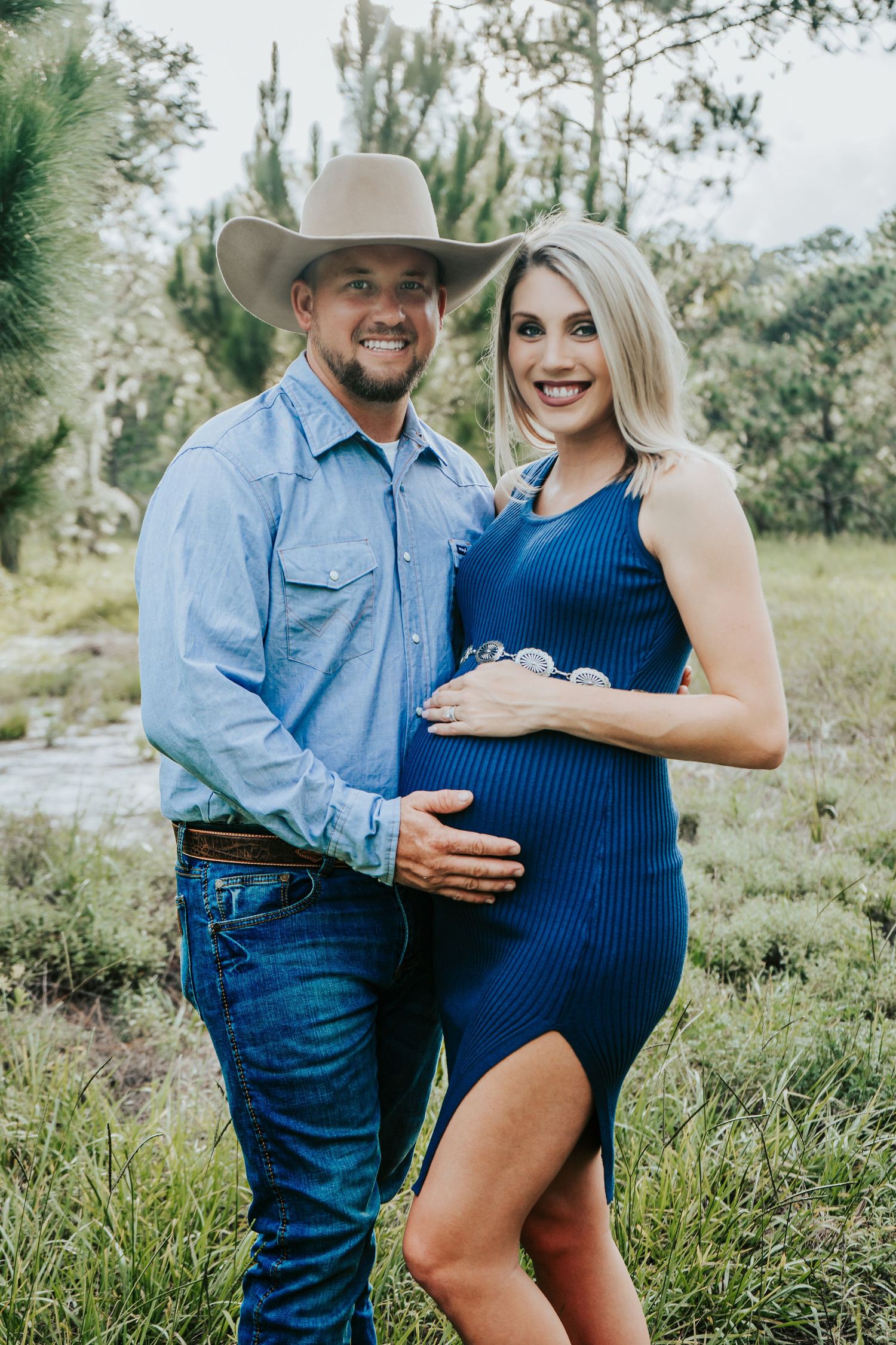 Outdoor Maternity Session at Thatcher Park, Lithia, FL; husband holding pregnant wife in the scrub brush