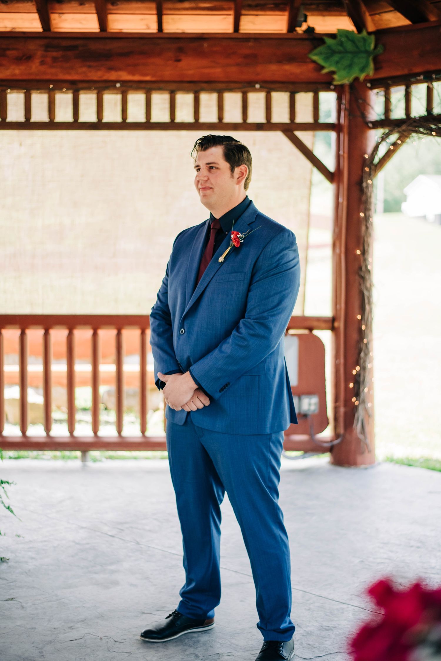 groom teary-eyed as he sees his bride coming down the aisle