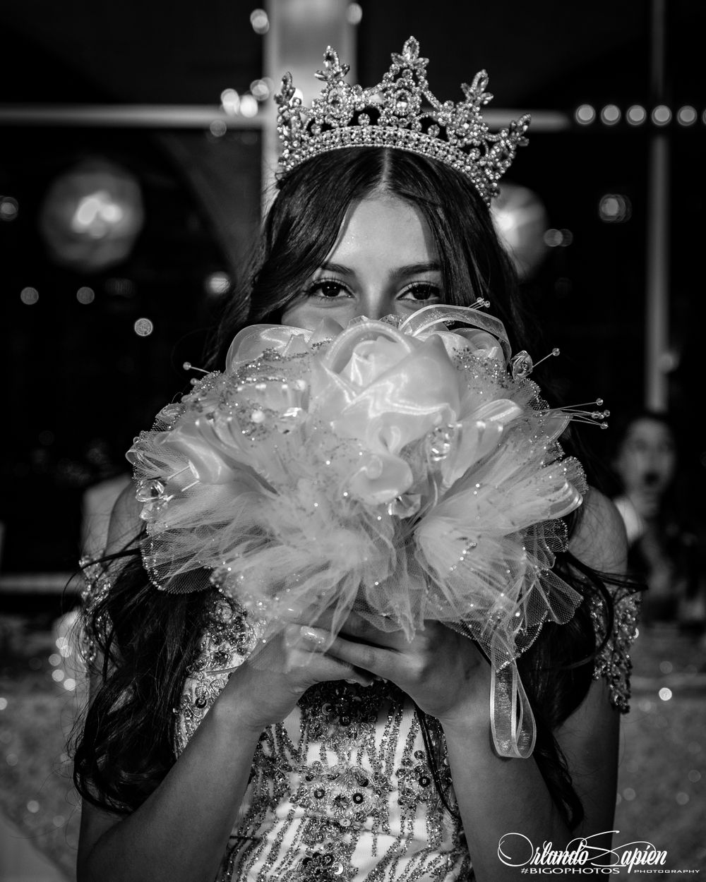 A celebratory moment captured in black and white with sparkling decorative elements.