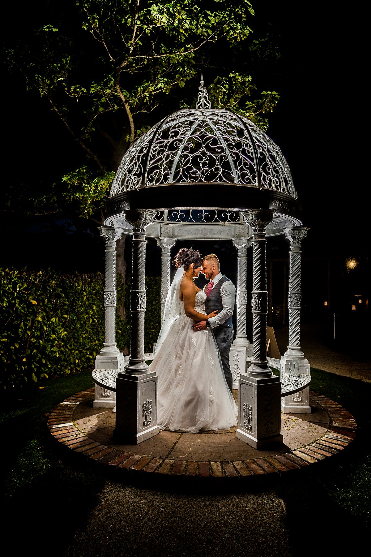 bride and groom under an ornate gazebo at the Nottinghamshire golf club