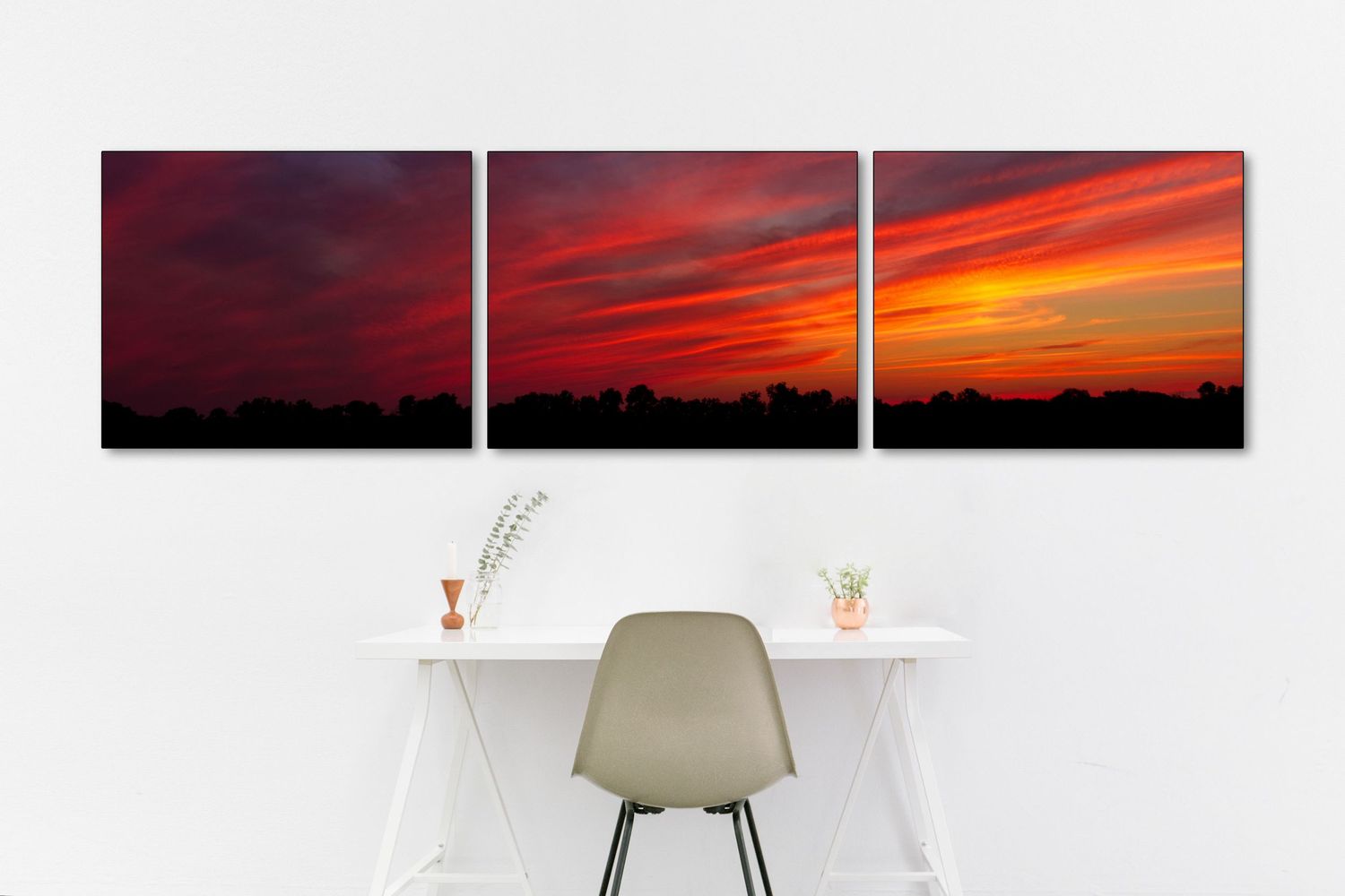 Vibrant Michigan sunset framed in three prints over a desk. It is a clean and modern look, but full of color and nature.
