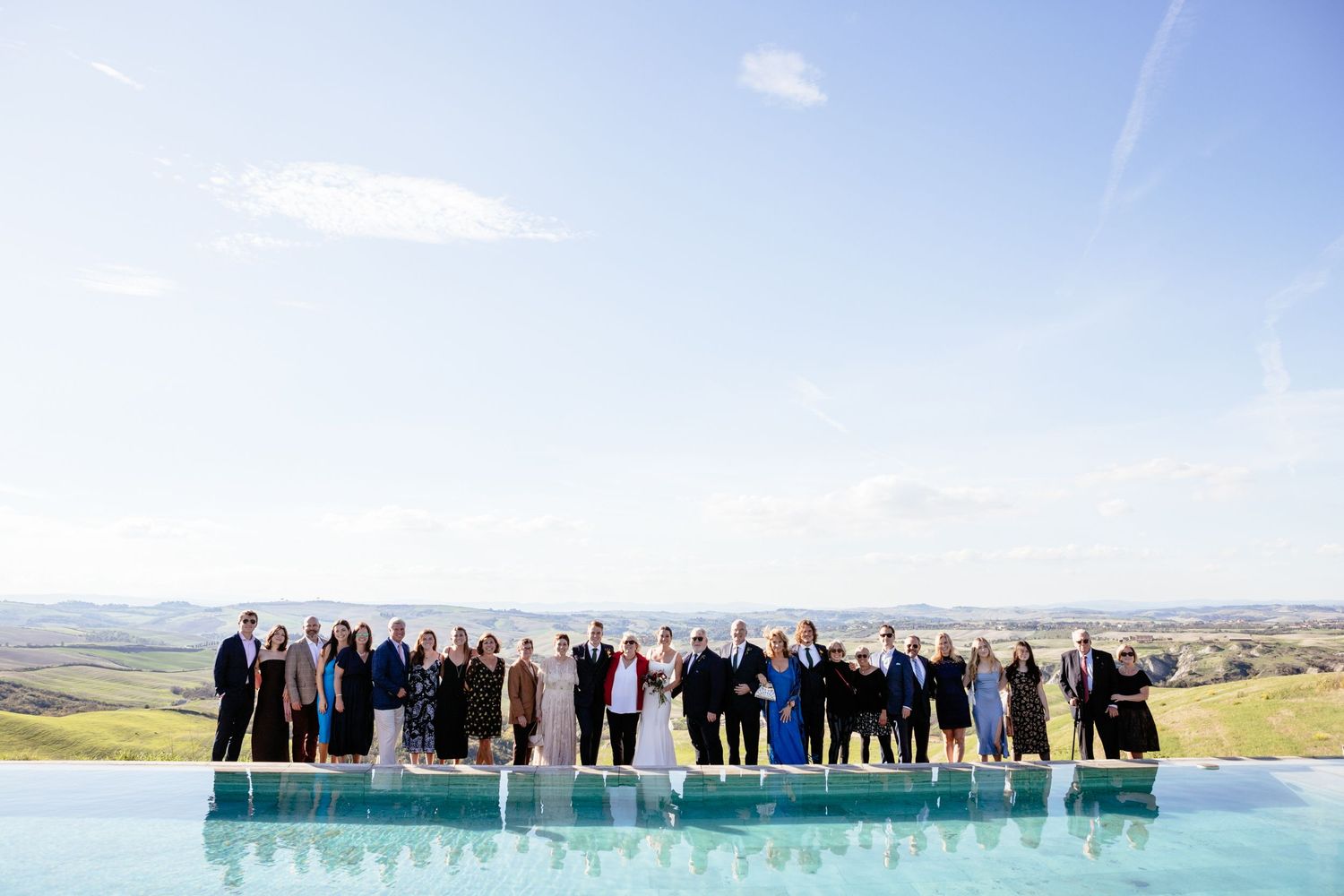 Group photograph taken at the Lazy Olive with the rolling hills of Siena in the backdrop.