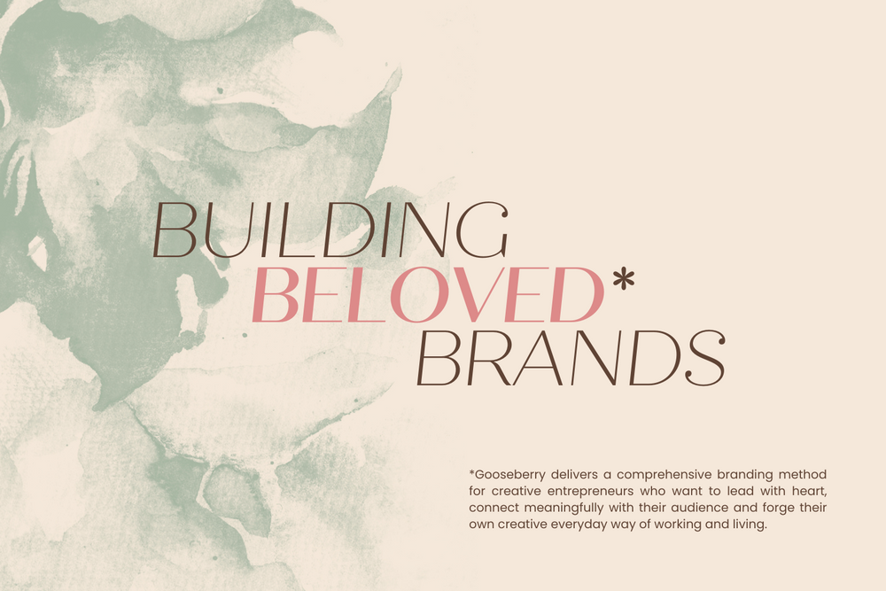 Elegant text overlay reads 'Building Beloved Brands' on pale watercolor background with green tones.
