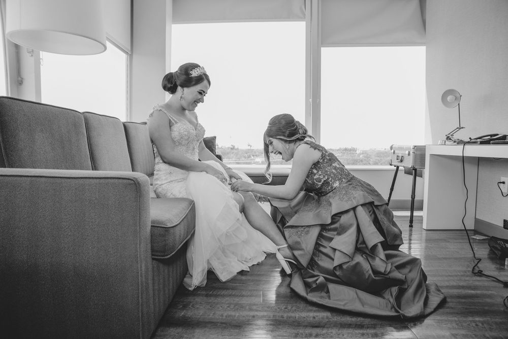 wedding garter. black and white. mother and daughter at getting ready. cambria hotel. McAllen, Texas. Wedding photograph
