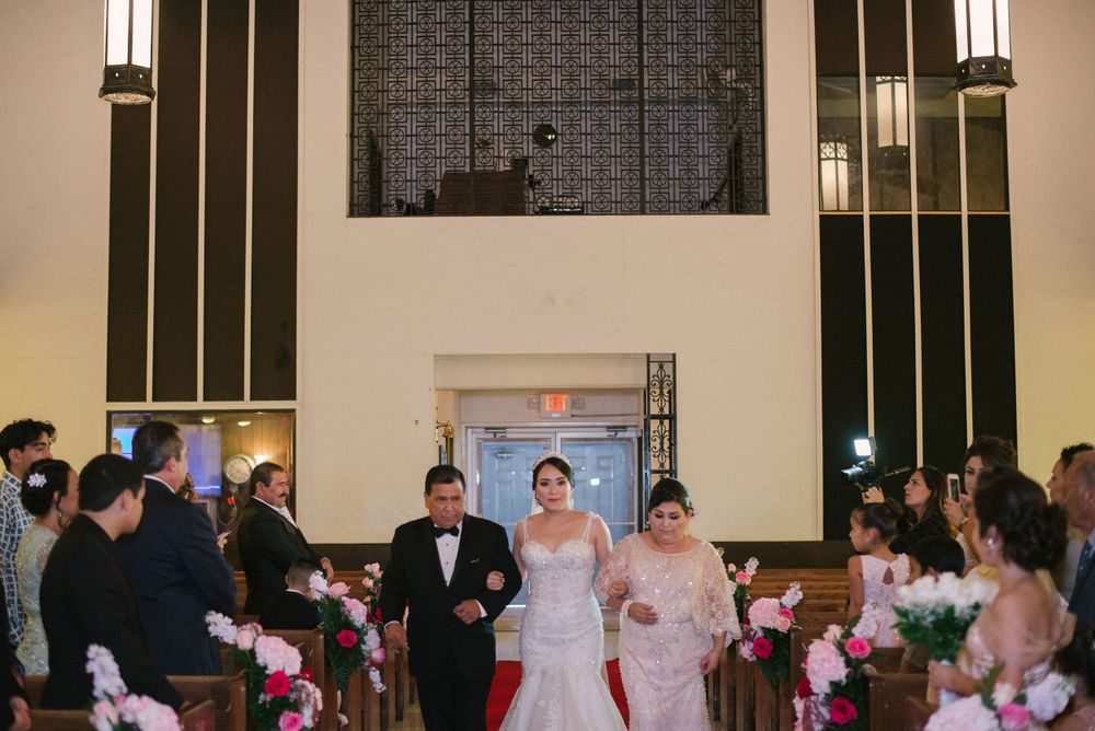 wedding ceremony. bride walking down the aisle. mother and daughter at getting ready. St Jude Catholic Church. pharr