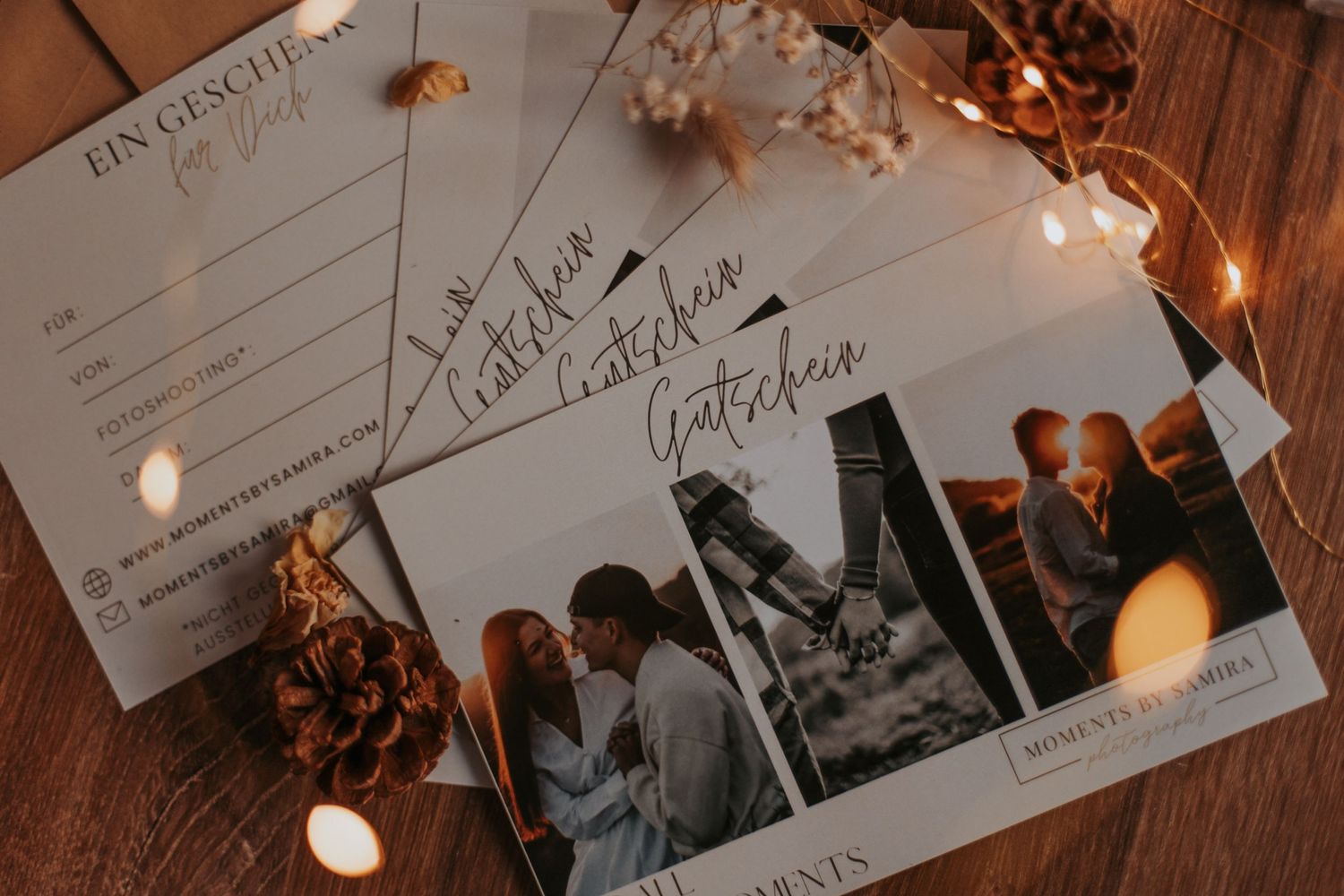 Handwritten wedding guest book pages illuminated by warm string lights.