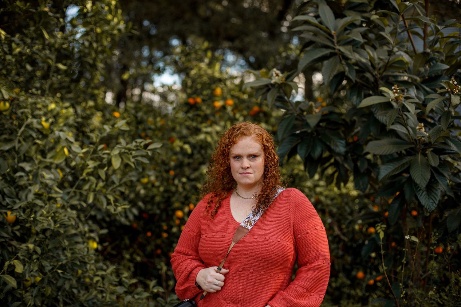 Self portrait of photographer in front of beautiful fruit trees in Live Oak, FL. Photographer introduction.