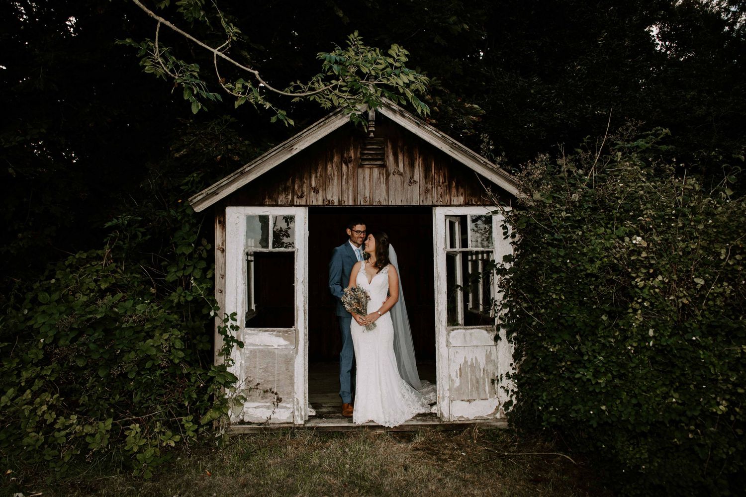 Northalerton Wedding at venue, Solberge Hall, couple in old hut