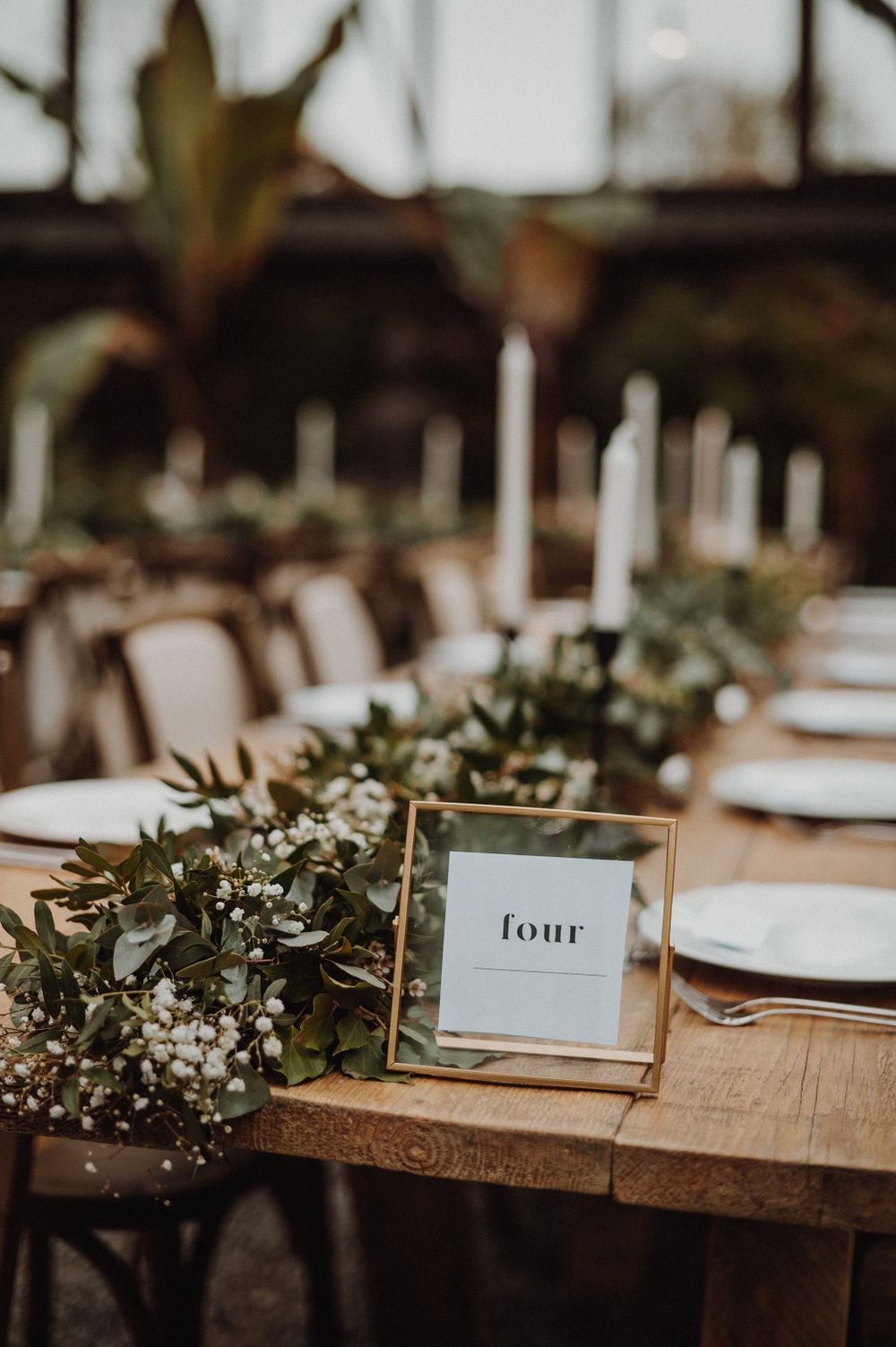 Wedding breakfast table set up with table number and garland at Anran Luxury Wedding Venue