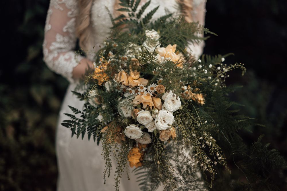 Bride holding her wedding bouquet at Westcott Barton