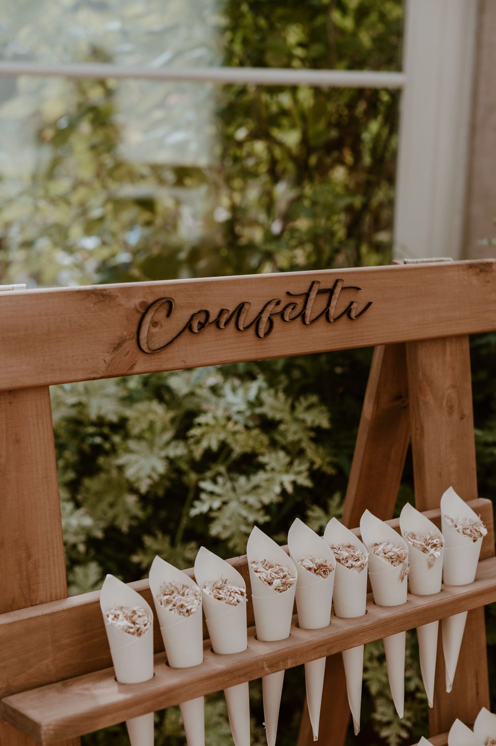 Confetti stand with cones of confetti at Clevedon Hall wedding