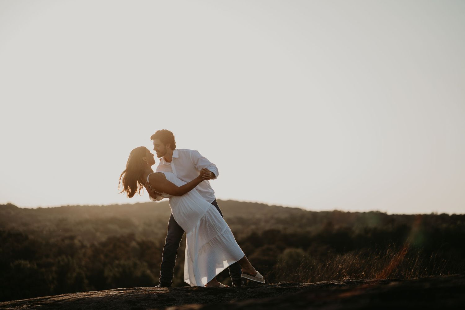 Bride and groom dancing at the sunset on top of Arabia Mountain, GA
