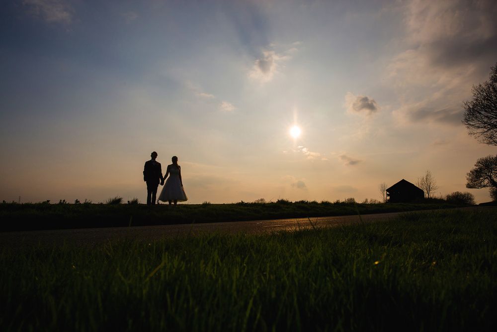 Bride & Groom in silhouette in at Donnington Park Wedding Venue