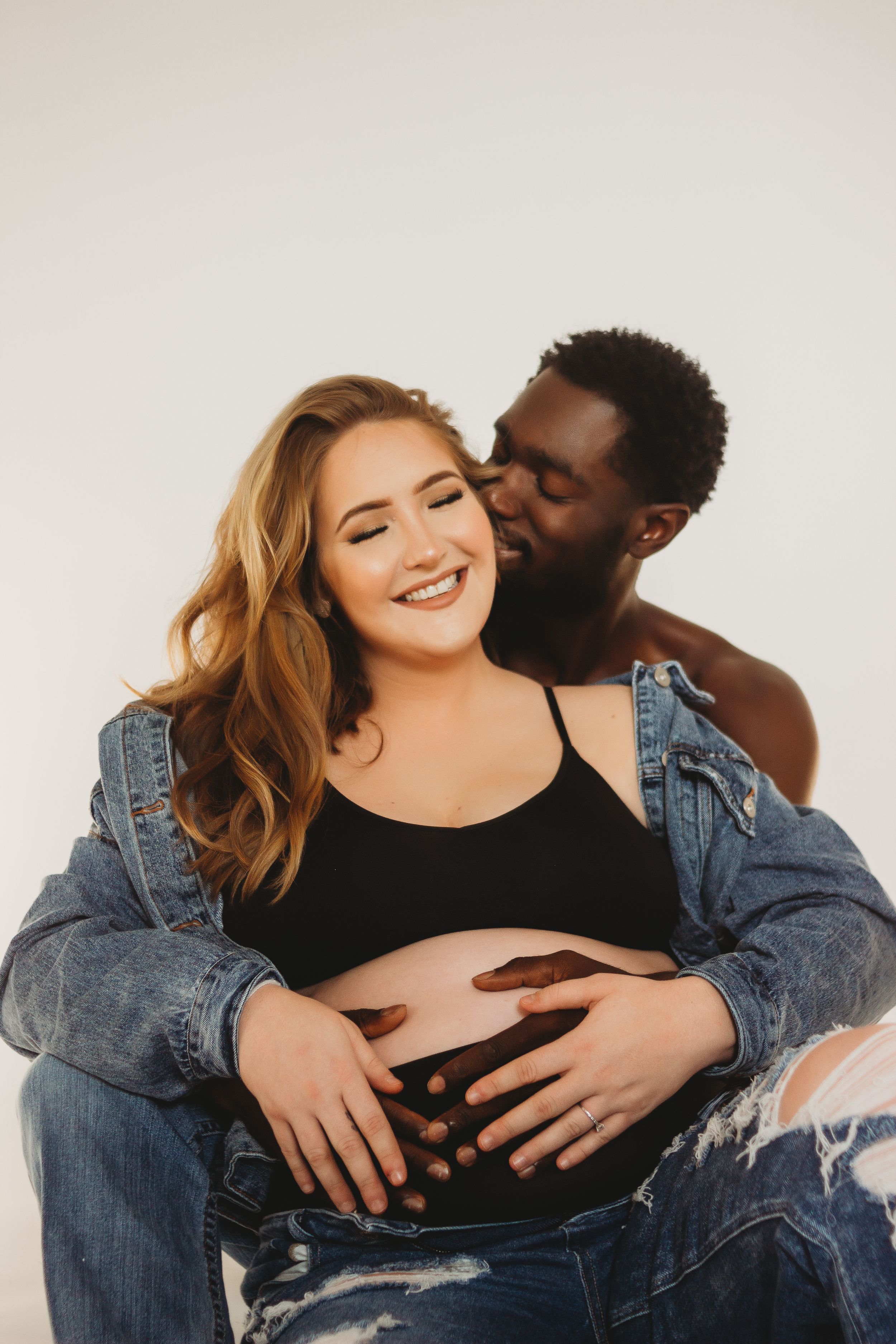 smiling couple belly maternity shot