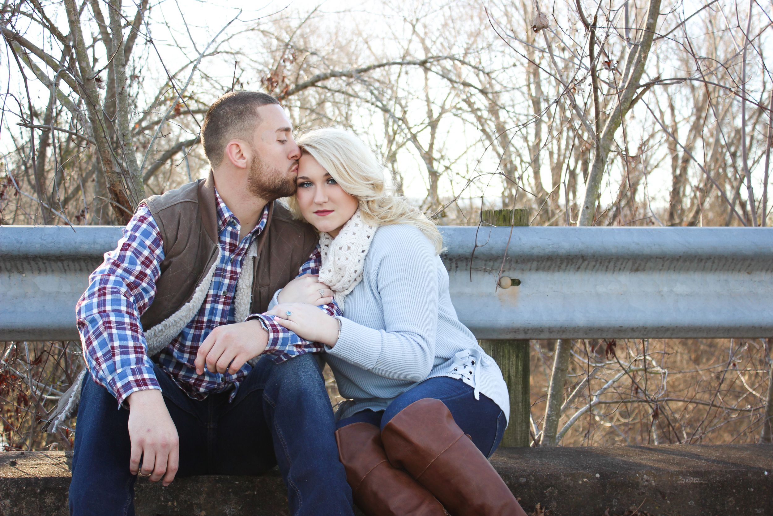 couple sitting near road