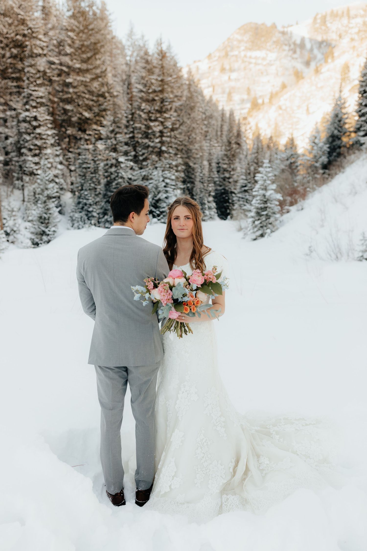 Groom watching bride, bride looks forward