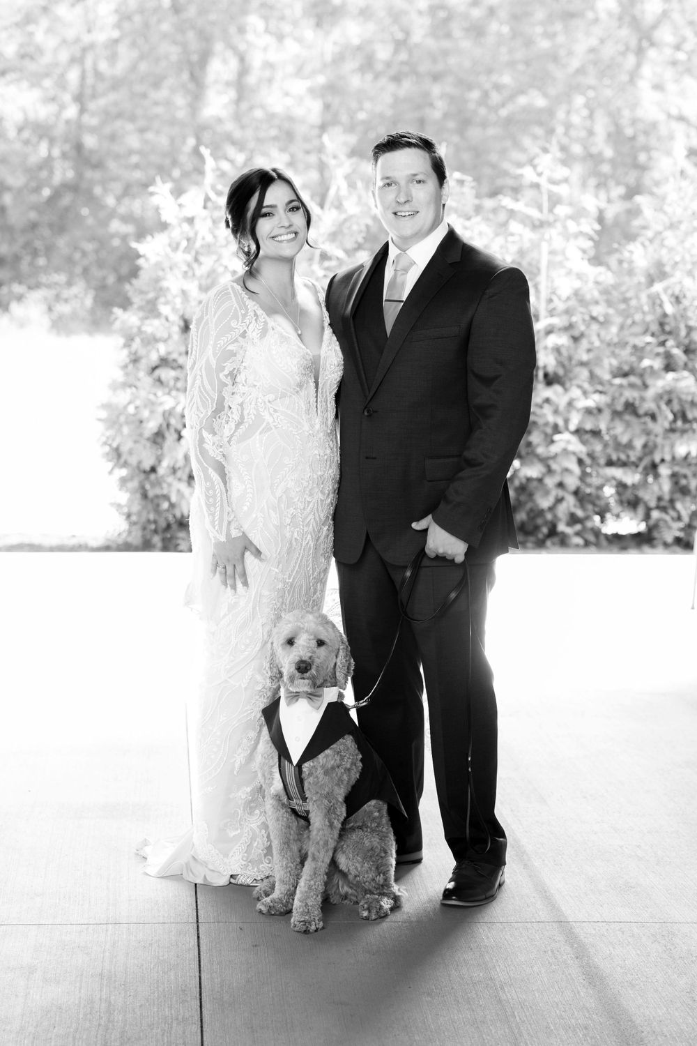 Bride and groom with their dog on wedding day at Jorgensen Farms in Westerville, Ohio.