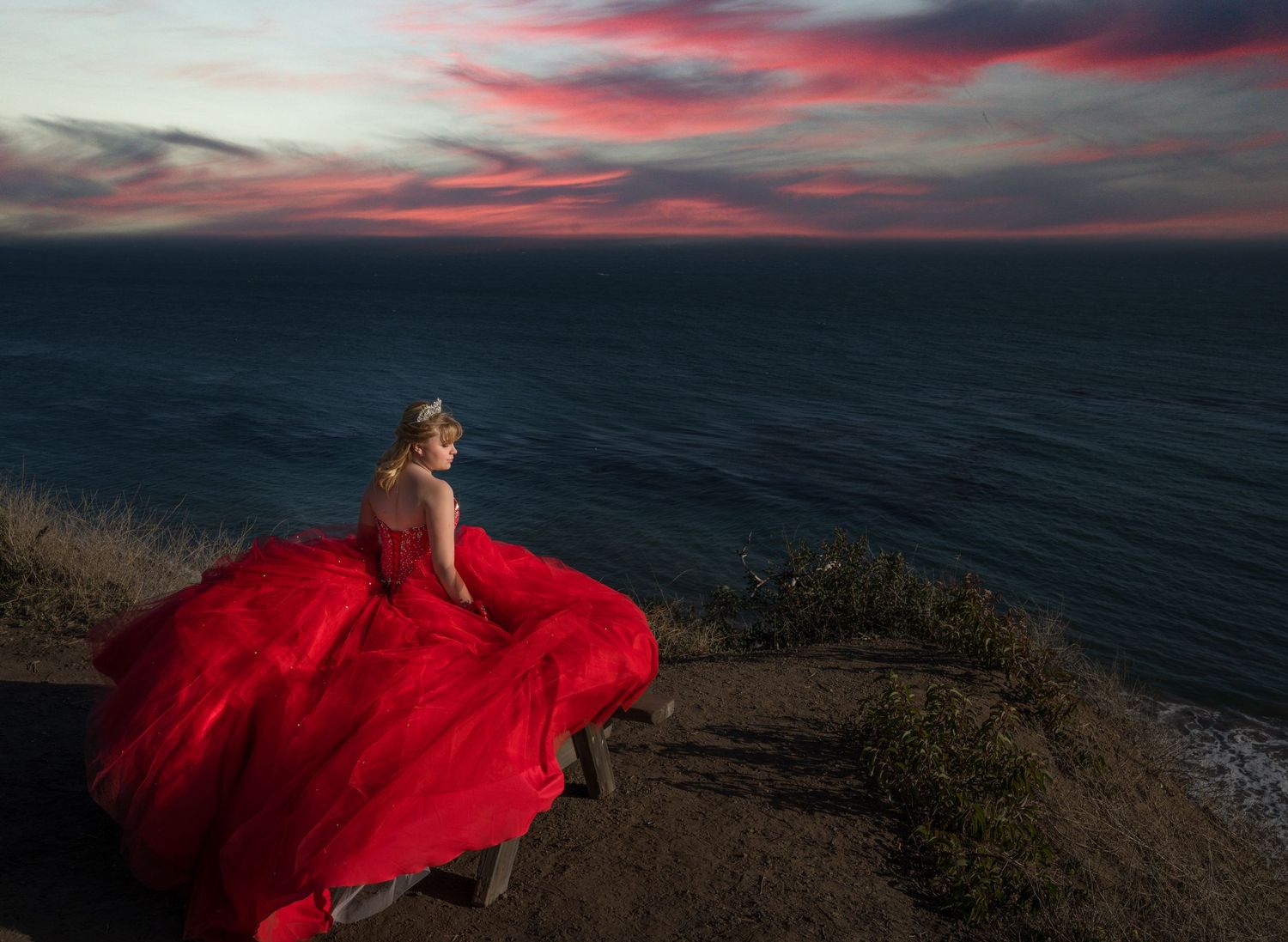 15 year old girl in a gown on the beach during sunset