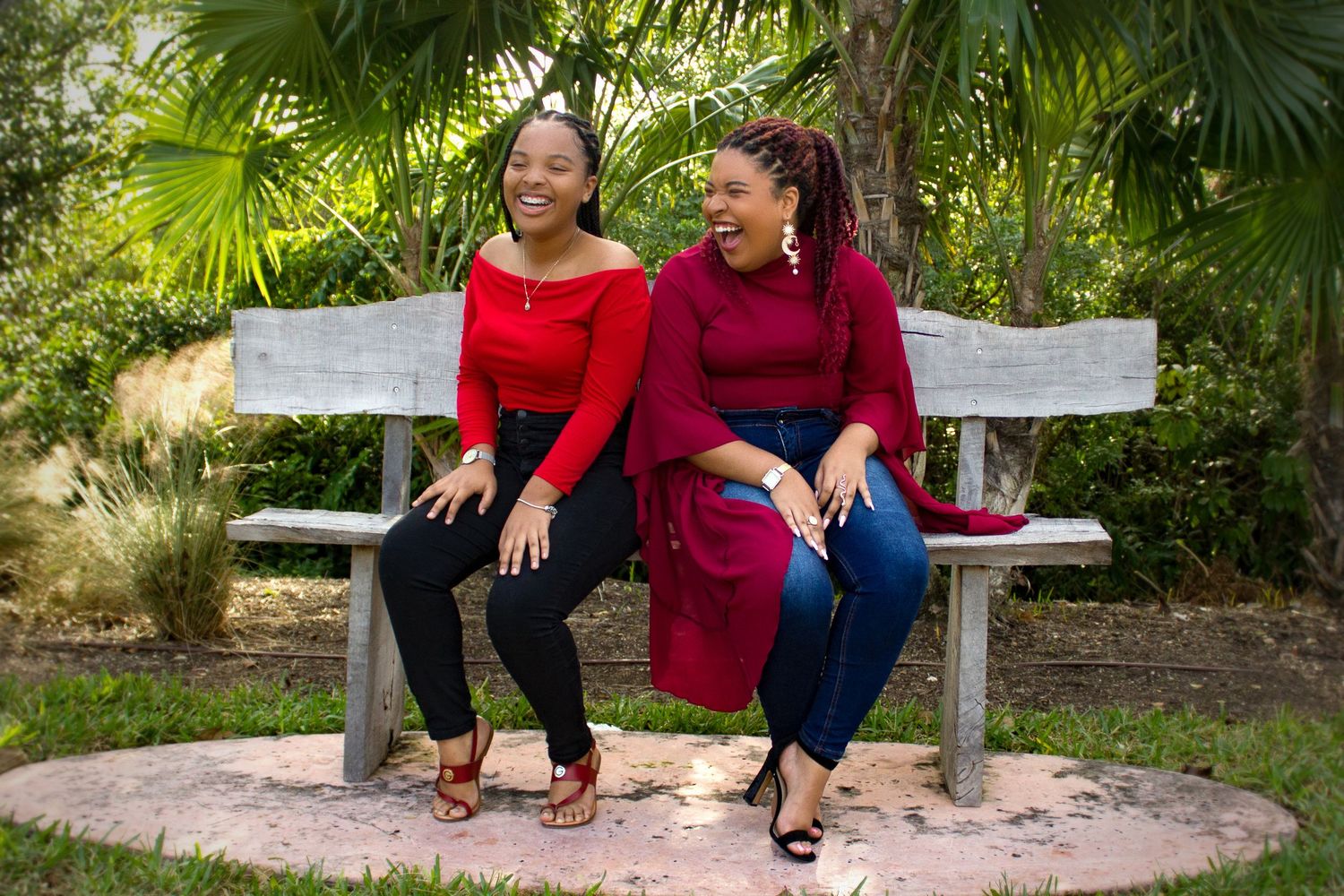 Sisters in red laughing sitting park bench, nassau bahamas photographer, K. Yolanda Turnquest Photography