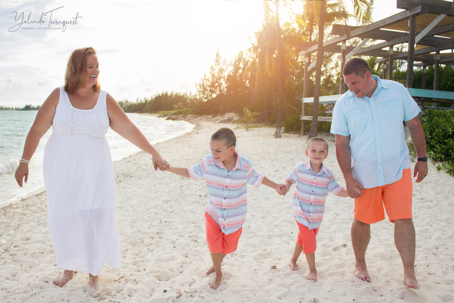 family of four on beach at sunset, nassau bahamas photographer, K. Yolanda Turnquest Photography