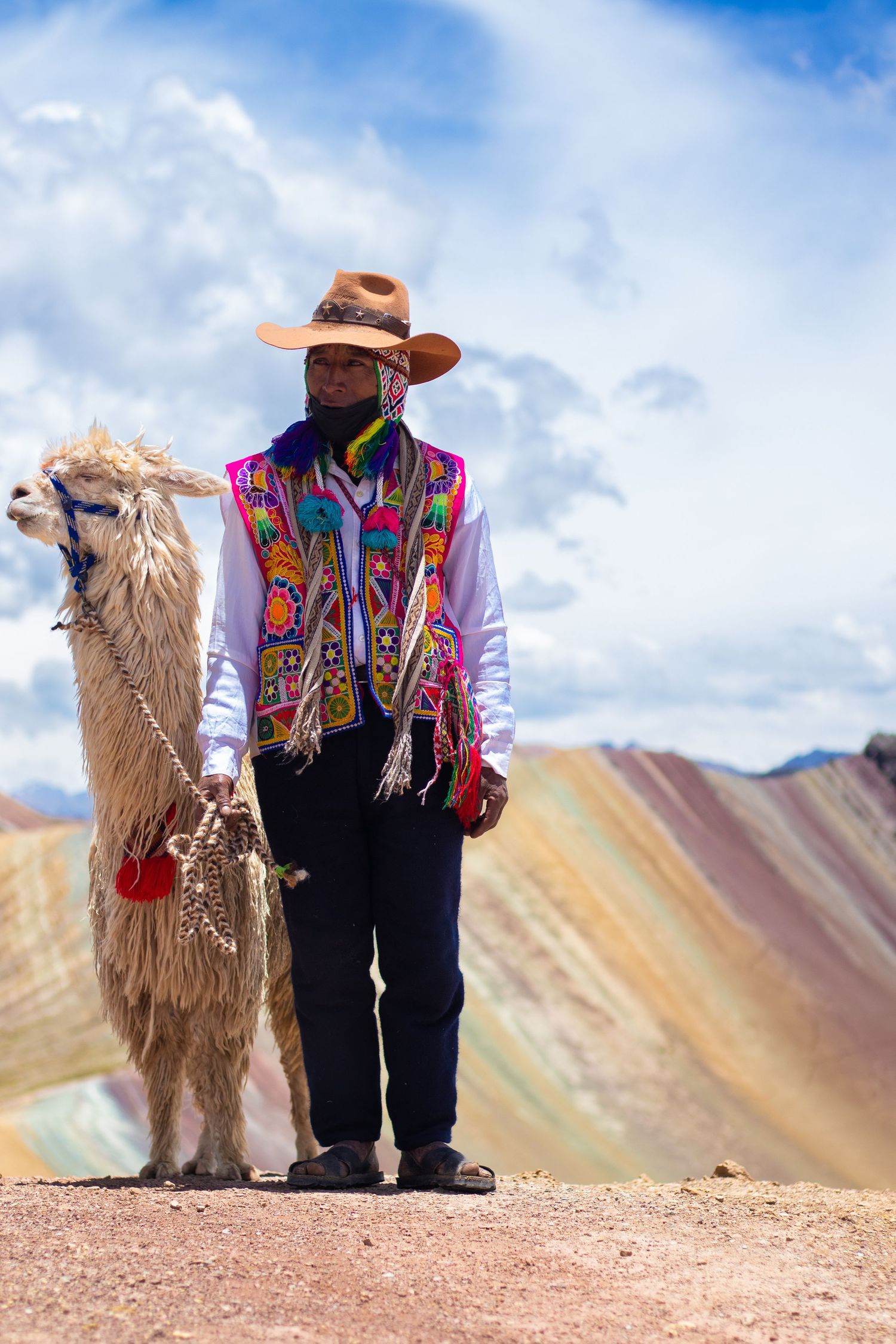 A local with his llama on Palcoyo mountain, Peru