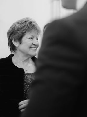the mother of the groom in black and white image being so happy
