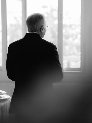 a black and white image of the groom's father