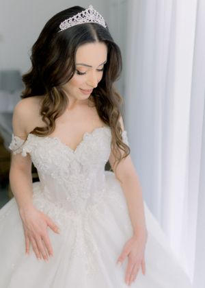 a gorgeous bride posing with her bridal dress