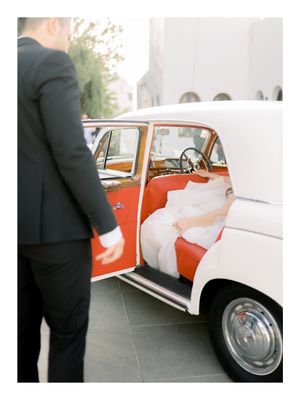 bride about to come out of her car that took her to church