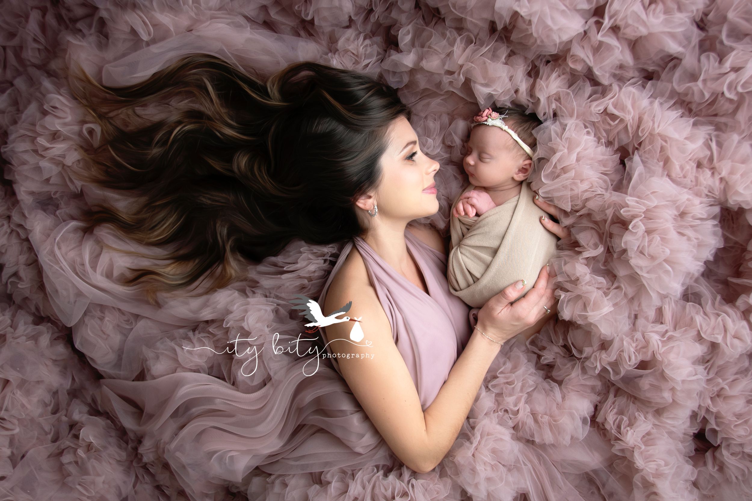 Newborn & Family Photographer Mom & Baby in a beautiful lay down image