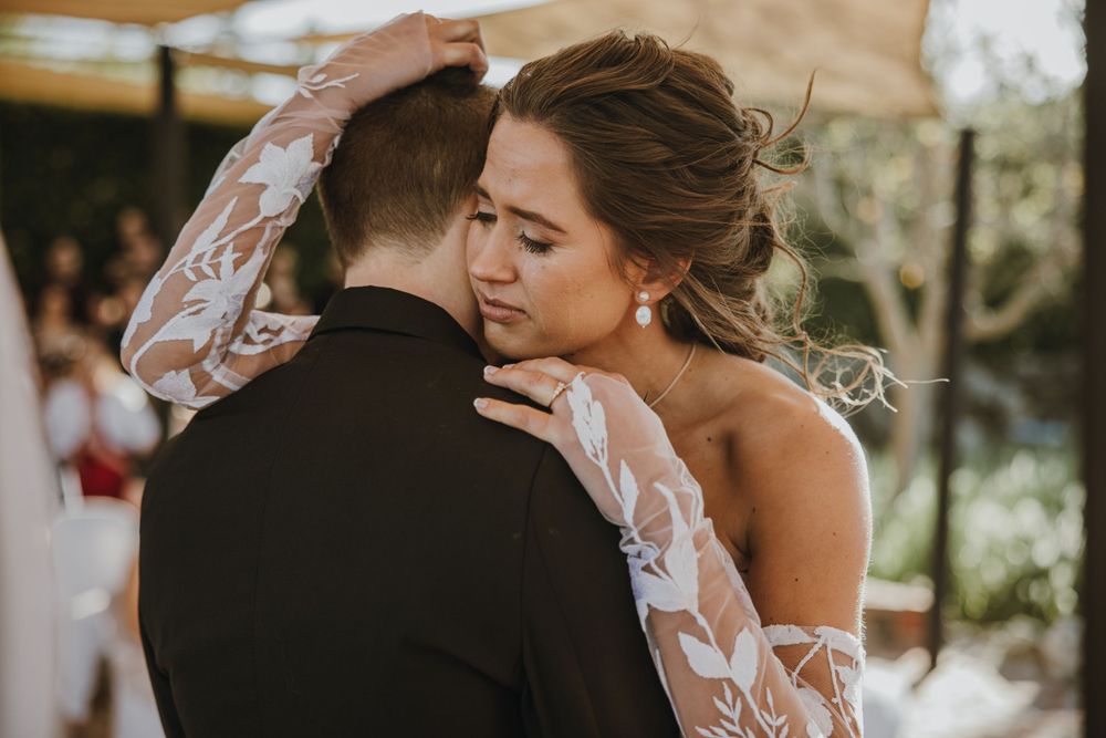 A romantic moment captured between newlyweds during their first dance.