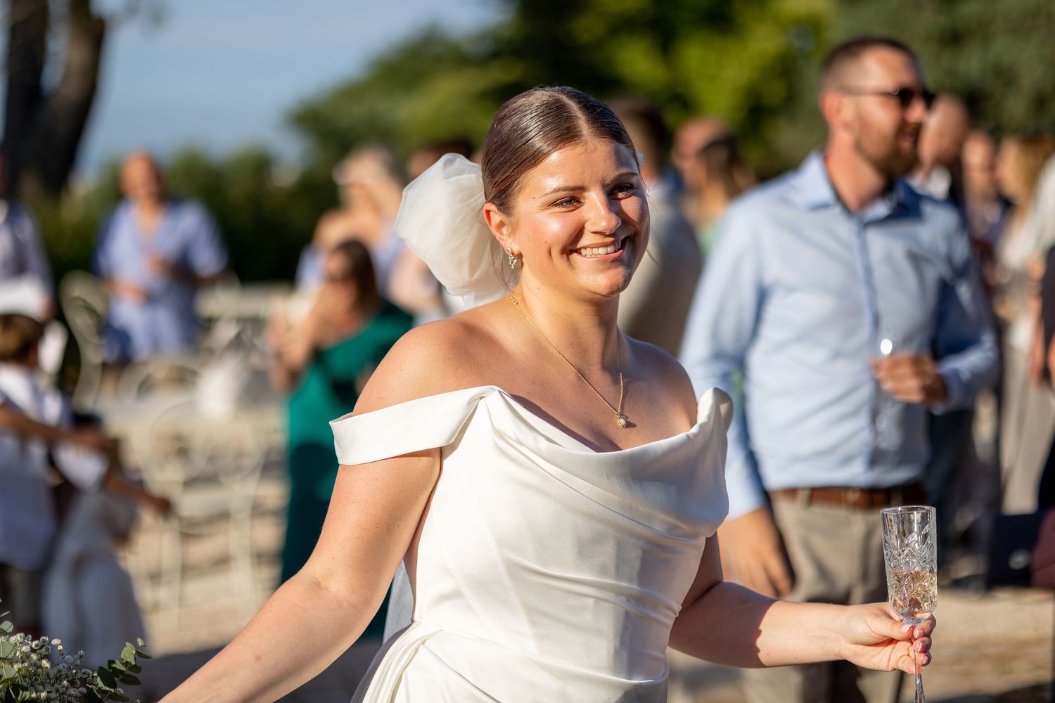 Bride smiling with warm sun glow at her wedding in Puglia, Italy