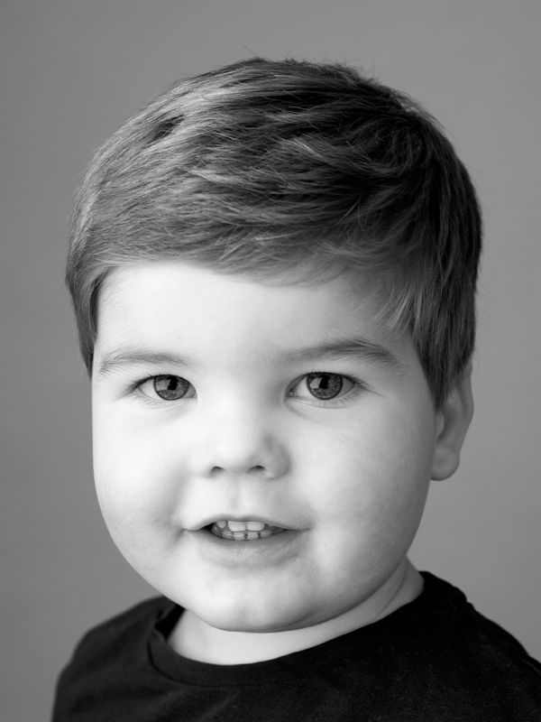 Stunning graduated black and white image of young boy by family photographer Abigail's Studio, High Wycombe