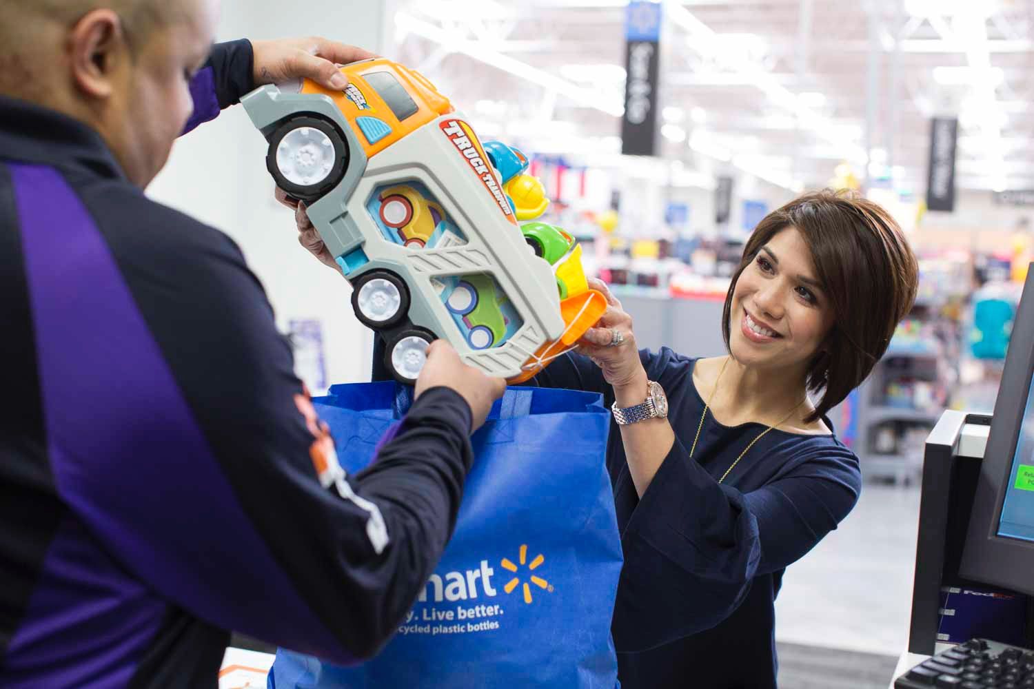 A FedEx Office associate prepares a customers items to be boxed and shipped.