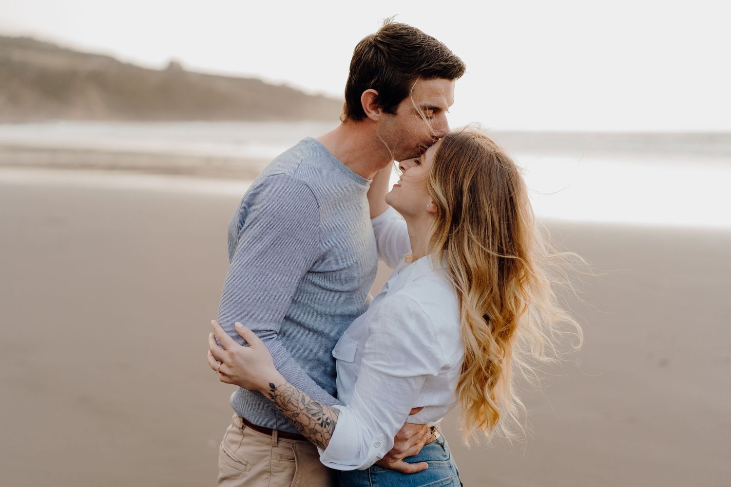 beautiful couple embracing on a beach