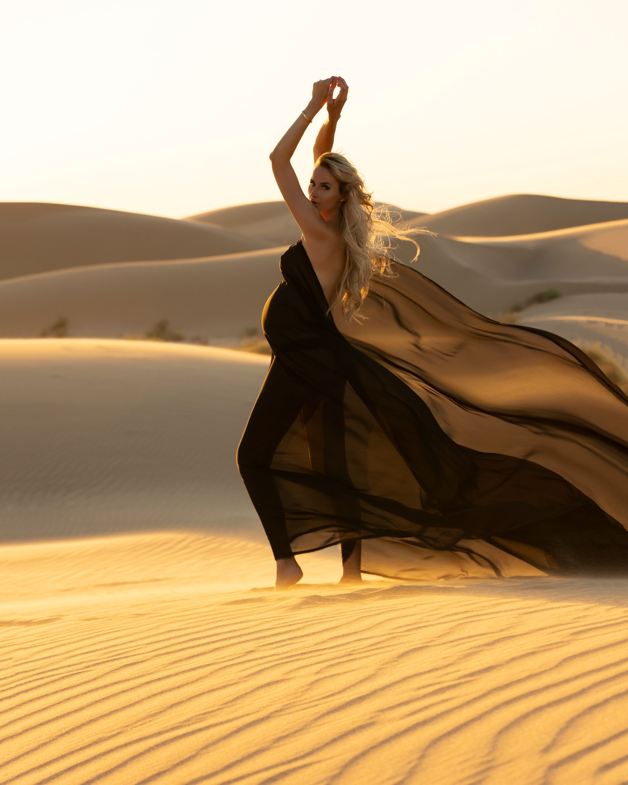 Glamis Sand Dunes Maternity Photoshoot, artistic desert with chiffon wrapping fabric, captured by Daryana Orange.