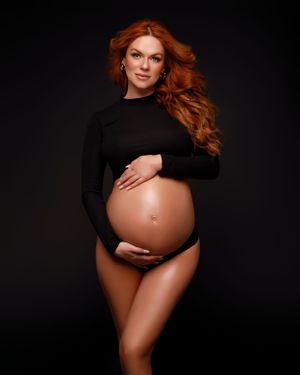 Timeless Black and White Studio Maternity Photoshoot, wearing a black crop top in San Diego, captured by Daryana Orange.