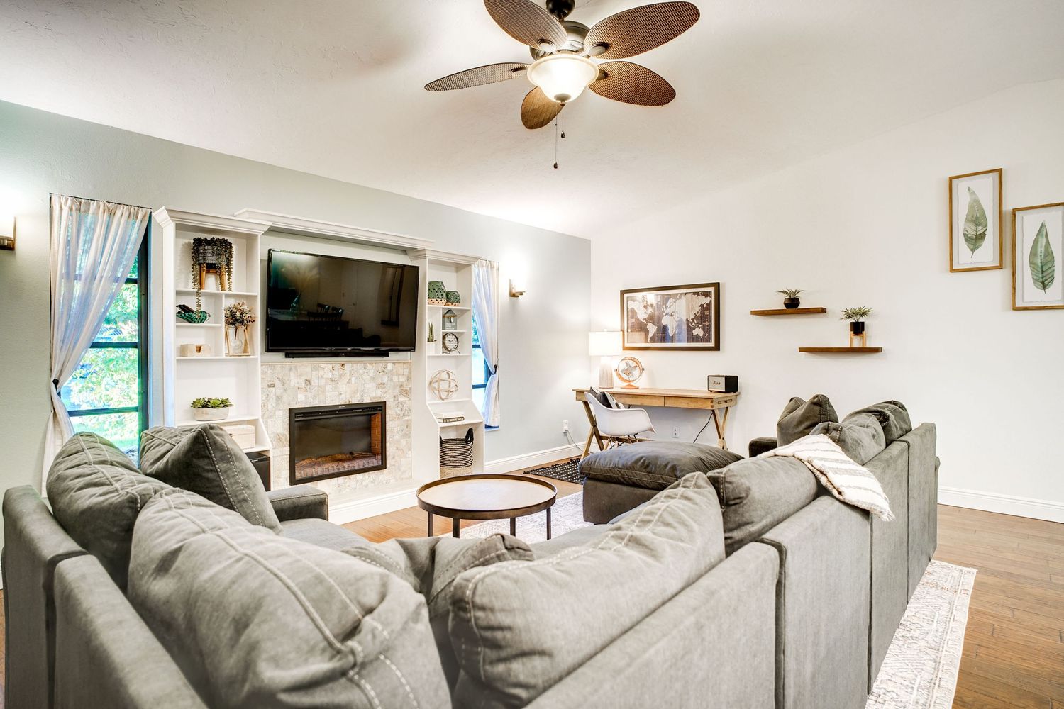 a professional real estate photo of a modern, well-decorated living room in a home in florida